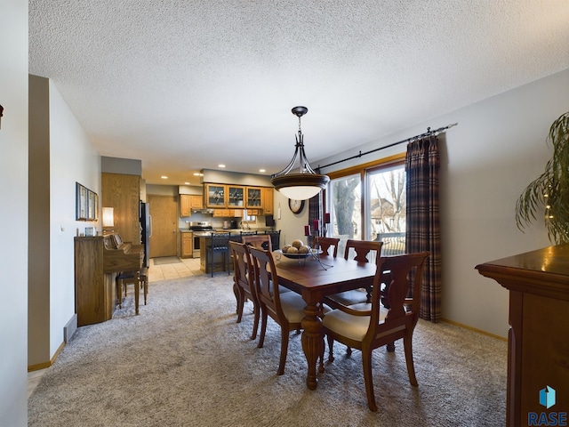 2904 E 52nd St, Sioux Falls, SD 57103 - dining area with light carpet, a textured ceiling, baseboards, and recessed lighting