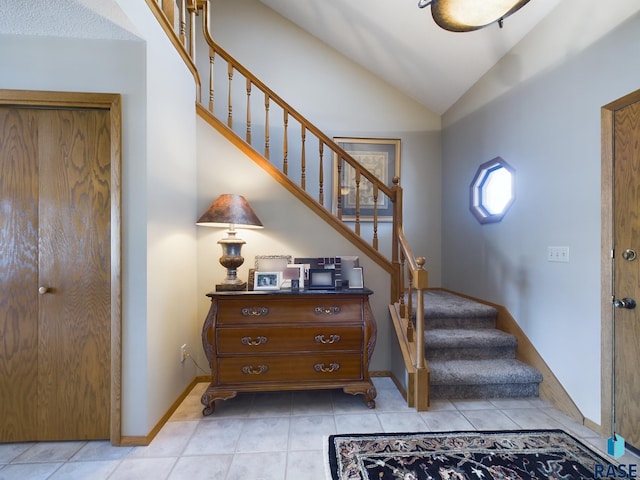 2904 E 52nd St, Sioux Falls, SD 57103 - staircase featuring vaulted ceiling, baseboards, and tile patterned flooring