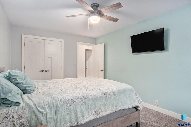 1034 N Elmwood Ave, Luverne, MN 56156 - carpeted bedroom with baseboards, a closet, and ceiling fan