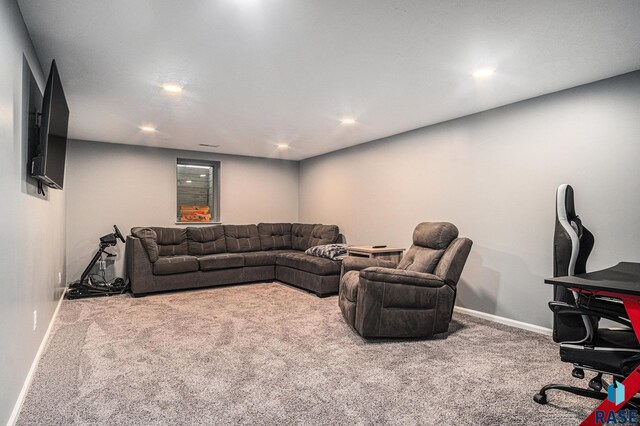 1034 N Elmwood Ave, Luverne, MN 56156 - living room featuring carpet floors, baseboards, and recessed lighting