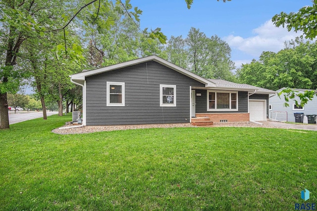 1034 N Elmwood Ave, Luverne, MN 56156 - ranch-style house with a garage, a front lawn, driveway, and central AC