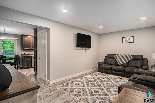 1034 N Elmwood Ave, Luverne, MN 56156 - living area featuring light wood-type flooring, baseboards, and recessed lighting