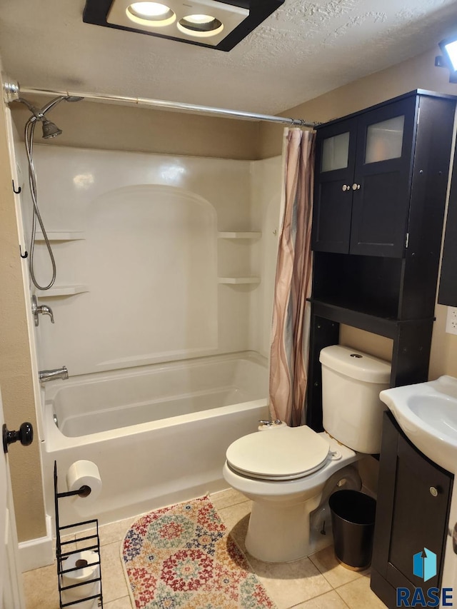 912 N Spring Ave, Sioux Falls, SD 57104 - full bath featuring tile patterned floors, shower / bath combo, toilet, a textured ceiling, and vanity