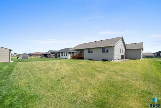 525 Quartzite Ave, Tea, SD 57064 - rear view of house with a deck and a yard
