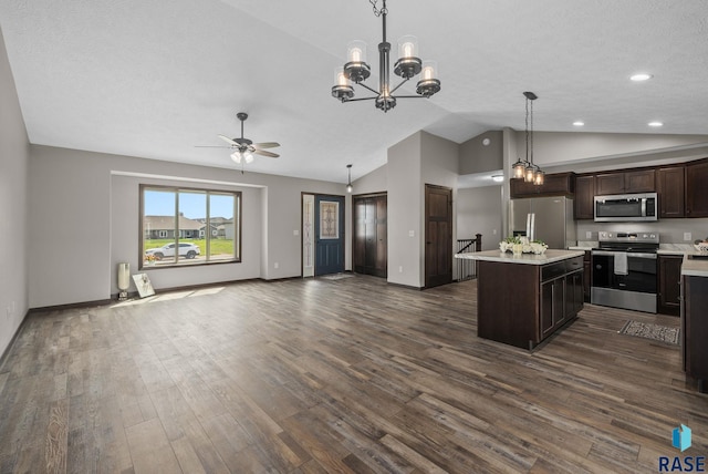 525 Quartzite Ave, Tea, SD 57064 - kitchen featuring stainless steel appliances, open floor plan, dark brown cabinets, light countertops, and dark wood-style flooring