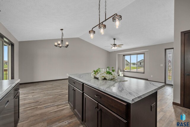 525 Quartzite Ave, Tea, SD 57064 - kitchen with lofted ceiling, a textured ceiling, light wood finished floors, a ceiling fan, and light countertops