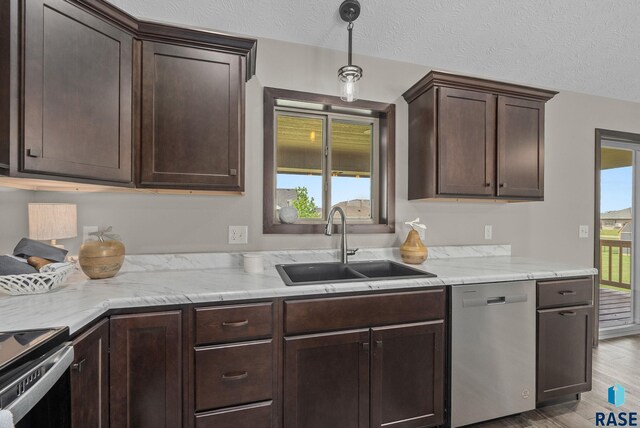 525 Quartzite Ave, Tea, SD 57064 - kitchen featuring dishwasher, a sink, dark brown cabinetry, light wood-type flooring, and range with electric stovetop