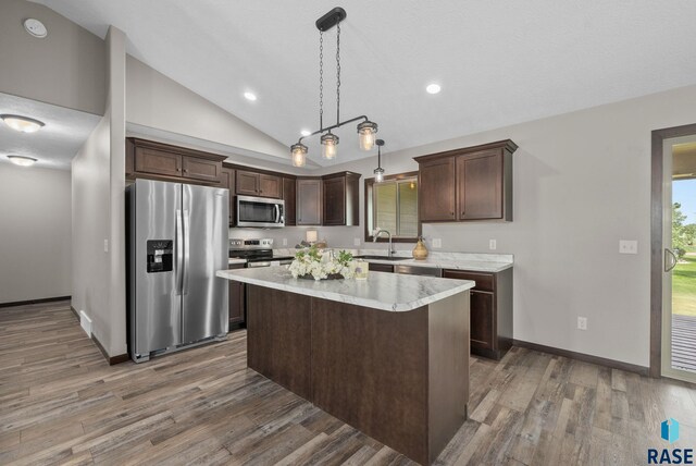 525 Quartzite Ave, Tea, SD 57064 - kitchen featuring appliances with stainless steel finishes, dark brown cabinets, wood finished floors, light countertops, and recessed lighting