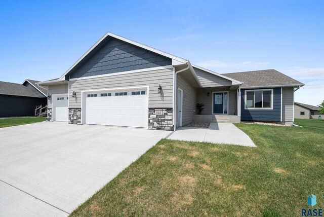 525 Quartzite Ave, Tea, SD 57064 - view of front of property with a garage, concrete driveway, and a front yard