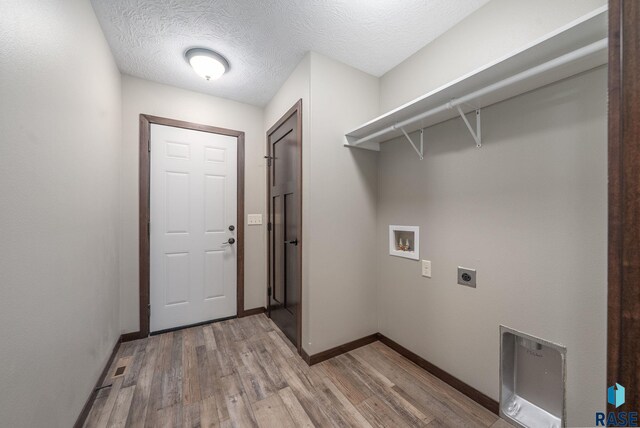 525 Quartzite Ave, Tea, SD 57064 - laundry area with hookup for an electric dryer, light wood-style floors, washer hookup, baseboards, and heating unit