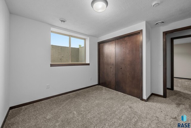 525 Quartzite Ave, Tea, SD 57064 - unfurnished bedroom with a closet, baseboards, and carpet flooring