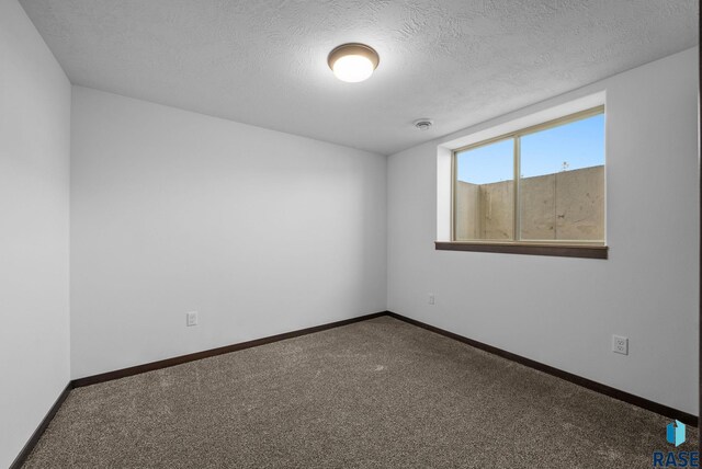 525 Quartzite Ave, Tea, SD 57064 - empty room with carpet floors, baseboards, and a textured ceiling