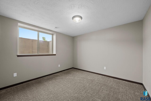 525 Quartzite Ave, Tea, SD 57064 - unfurnished room featuring carpet floors, baseboards, and a textured ceiling