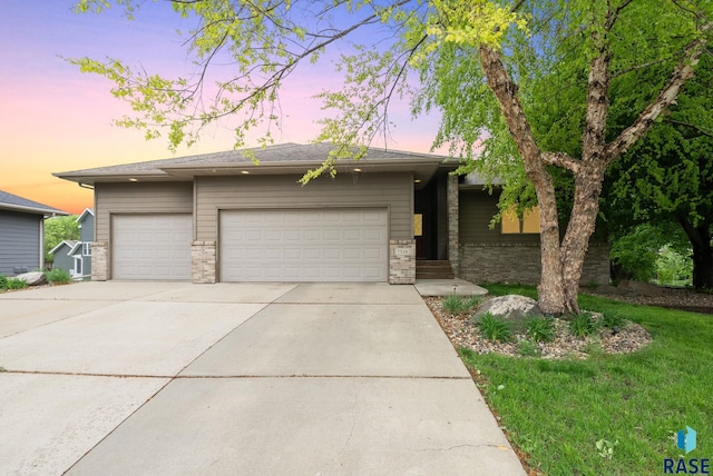 5516 S Tierney Pl, Sioux Falls, SD 57108 - view of front facade featuring an attached garage, concrete driveway, and brick siding