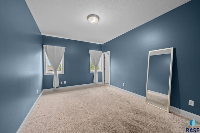 5516 S Tierney Pl, Sioux Falls, SD 57108 - unfurnished bedroom featuring carpet flooring, baseboards, and a textured ceiling