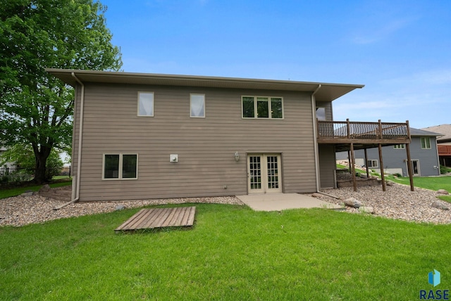 5516 S Tierney Pl, Sioux Falls, SD 57108 - rear view of house with french doors, a yard, a wooden deck, and a patio