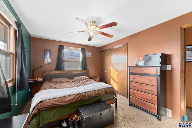 316 S Norbeck St, Vermillion, SD 57069 - carpeted bedroom with a ceiling fan and a closet