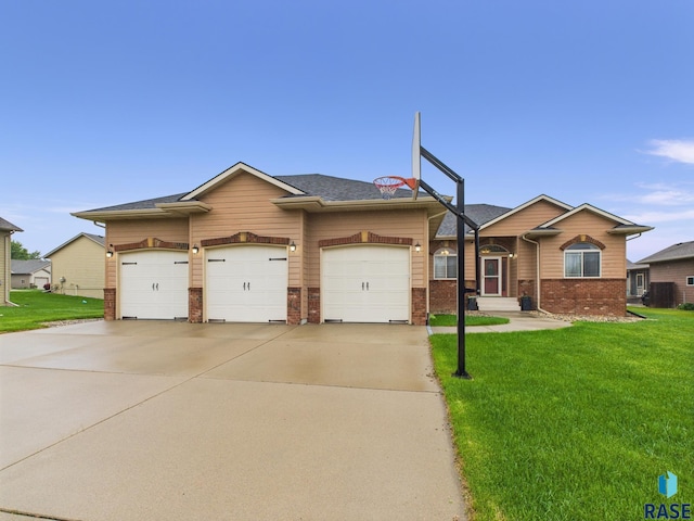 8113 S Copper Ridge Rd, Sioux Falls, SD 57108 - view of front facade featuring a front yard, brick siding, a garage, driveway, and a shingled roof