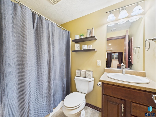 8113 S Copper Ridge Rd, Sioux Falls, SD 57108 - bathroom featuring toilet, vanity, a shower with shower curtain, a textured ceiling, and tile patterned floors
