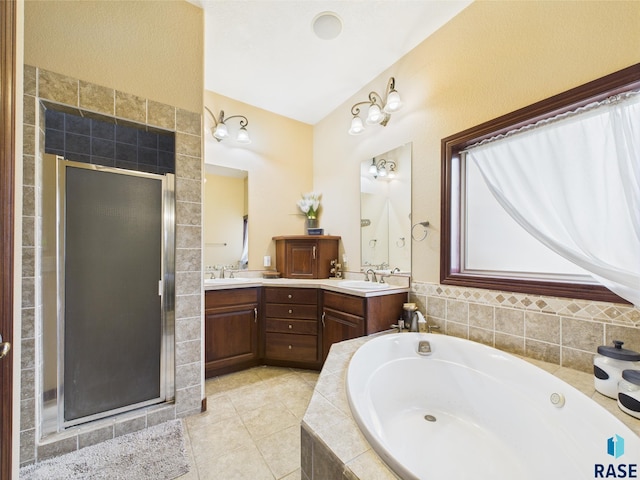 8113 S Copper Ridge Rd, Sioux Falls, SD 57108 - full bathroom featuring a stall shower, a garden tub, double vanity, and tile patterned floors