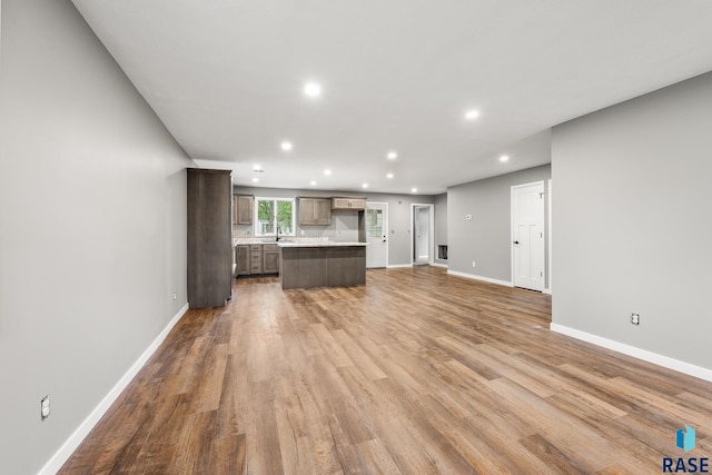 331 E Norton Ave, Salem, SD 57058 - unfurnished living room with recessed lighting, wood finished floors, and baseboards