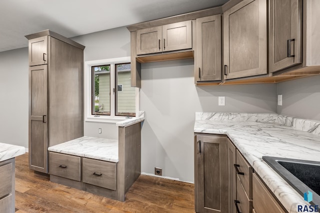 331 E Norton Ave, Salem, SD 57058 - kitchen featuring dark wood finished floors and light stone countertops