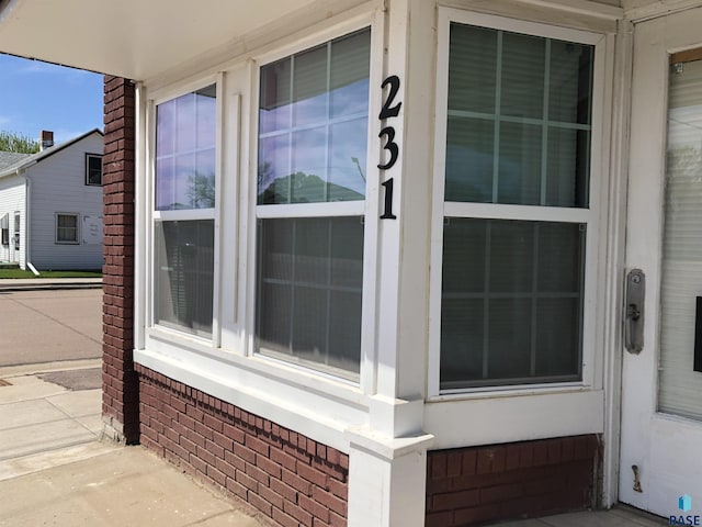 231 S 5th St, Menno, SD 57045 - view of property exterior featuring brick siding