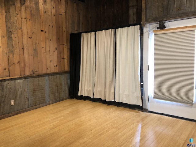 231 S 5th St, Menno, SD 57045 - spare room with wooden walls and wood finished floors