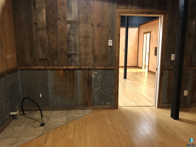 231 S 5th St, Menno, SD 57045 - empty room featuring wood finished floors and wooden walls