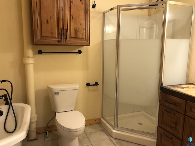 231 S 5th St, Menno, SD 57045 - bathroom with a shower stall, tile patterned flooring, toilet, a soaking tub, and baseboards