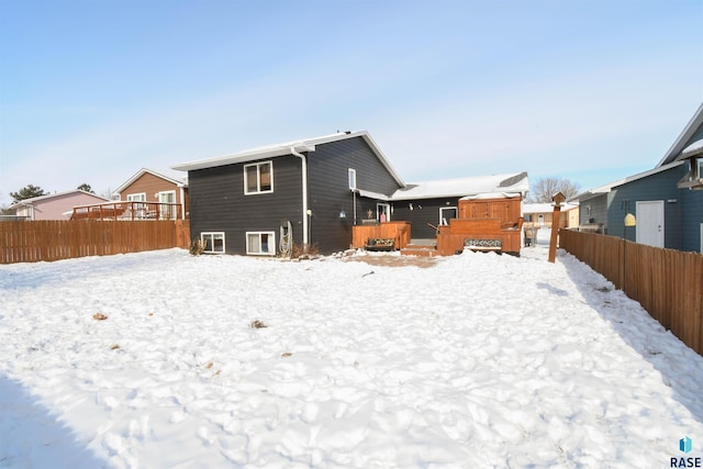 5813 W Clay St, Sioux Falls, SD 57106 - snow covered back of property featuring a wooden deck