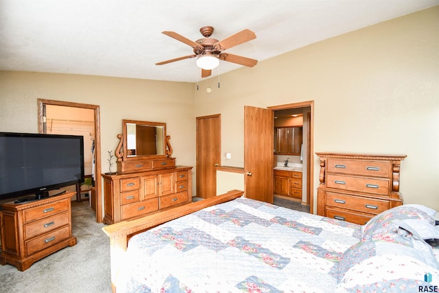 5813 W Clay St, Sioux Falls, SD 57106 - bedroom with light carpet, connected bathroom, a sink, and a ceiling fan