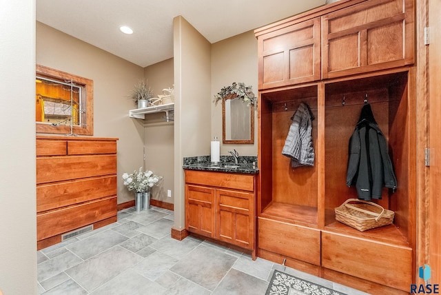 2502 S Big Timber Pl, Sioux Falls, SD 57105 - mudroom with a sink, light stone finish floors, baseboards, and recessed lighting