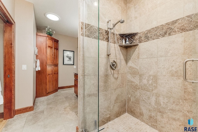 2502 S Big Timber Pl, Sioux Falls, SD 57105 - bathroom featuring a stall shower, baseboards, and vanity