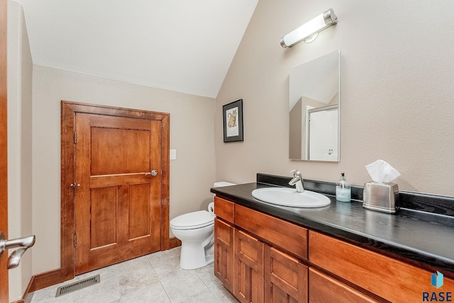2502 S Big Timber Pl, Sioux Falls, SD 57105 - bathroom featuring vaulted ceiling, vanity, toilet, and tile patterned flooring