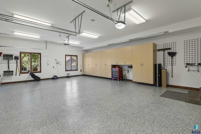 2502 S Big Timber Pl, Sioux Falls, SD 57105 - garage with baseboards and a garage door opener