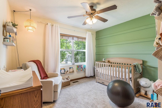 1808 S Mulberry Ave Unit D, Brandon, SD 57005 - carpeted bedroom with a nursery area and a ceiling fan
