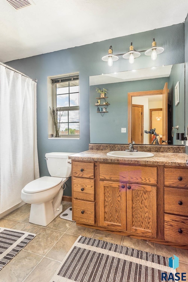 1808 S Mulberry Ave Unit D, Brandon, SD 57005 - bathroom with vanity and toilet