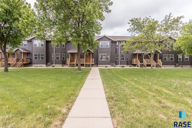 1808 S Mulberry Ave Unit D, Brandon, SD 57005 - view of home's community with a lawn and a wooden deck