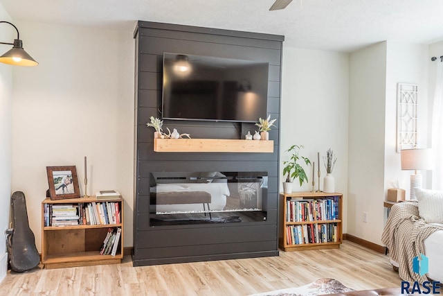 1808 S Mulberry Ave Unit D, Brandon, SD 57005 - living room featuring wood finished floors, baseboards, and ceiling fan
