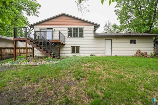 4301 E 28th St, Sioux Falls, SD 57103 - back of house with stairway and a wooden deck