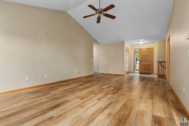 6700 W Snowberry Cir, Sioux Falls, SD 57106 - unfurnished living room featuring a ceiling fan, light wood-type flooring, high vaulted ceiling, and baseboards