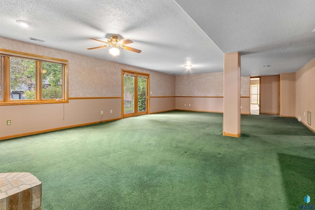 6700 W Snowberry Cir, Sioux Falls, SD 57106 - unfurnished living room featuring carpet flooring, a textured ceiling, baseboards, and ceiling fan