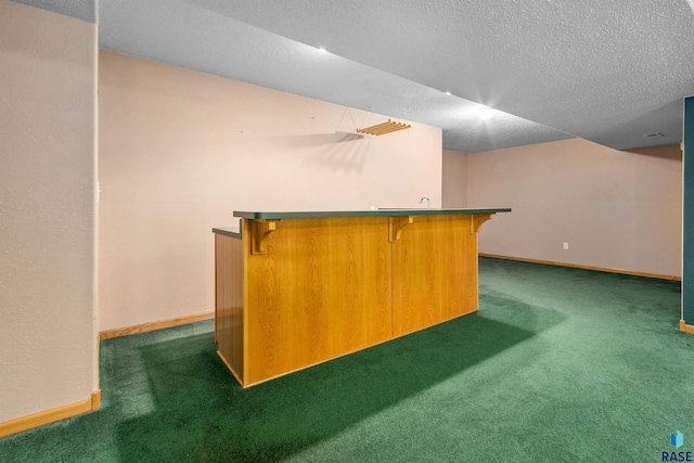 6700 W Snowberry Cir, Sioux Falls, SD 57106 - indoor dry bar featuring dark colored carpet, baseboards, and a textured ceiling
