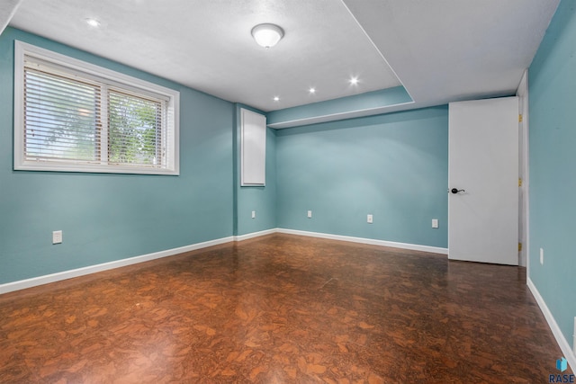 6700 W Snowberry Cir, Sioux Falls, SD 57106 - empty room featuring baseboards, dark flooring, and recessed lighting