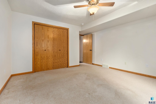 6700 W Snowberry Cir, Sioux Falls, SD 57106 - unfurnished bedroom with carpet, a closet, baseboards, and ceiling fan