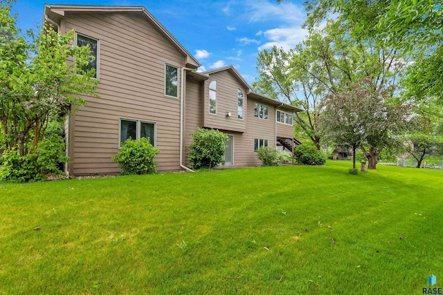 6700 W Snowberry Cir, Sioux Falls, SD 57106 - back of property featuring a lawn