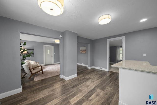 209 E Elm St, Harrisburg, SD 57032 - unfurnished room with dark wood-style flooring and baseboards
