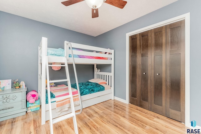 1302 Ripple Creek Rd, Dell Rapids, SD 57022 - bedroom featuring wood finished floors, a ceiling fan, and baseboards