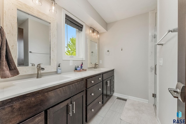 1302 Ripple Creek Rd, Dell Rapids, SD 57022 - full bath with double vanity, baseboards, and tile patterned flooring